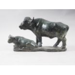 Z F Runyanga: a carved greenstone model of a water buffalo and calf, 14" long
