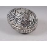A late 19th century chased and engraved silver egg with parcel gilt interior, marks Nathan and Hayes