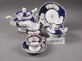 An early 19th century floral and lustre decorated bone china part teaset