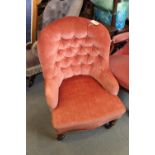 A late 19th century tub seat armchair, button upholstered in a pink velour, on turned and castored