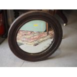 An oak framed circular wall mirror, 18 1/2" dia overall