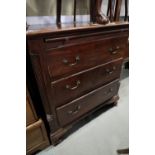 A bachelor's Georgian mahogany chest with fluted columns, fitted slide over three long graduated