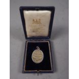 A cased silver HMS Ophir medal, dated 1901, a silver athletics medallion, three Victorian silver