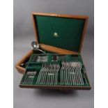 An oak part canteen of Mappin and Webb silver plated cutlery