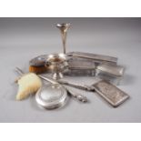 A silver crumb brush, a silver toilet pot cover, three silver plated toilet boxes, a silver backed