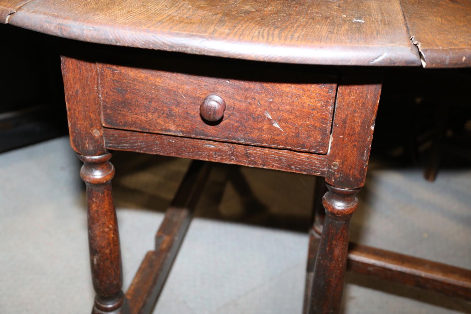 A 19th century oak oval gate leg dining table, on turned and stretchered supports, 48" wide x 62 1/ - Image 4 of 5