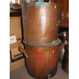 Two copper hot water cisterns, 17" dia, and two smaller similar two-handled pans, 11" dia and 12"