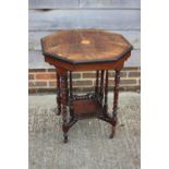 An Edwardian rosewood and inlaid octagonal two-tier occasional table, on turned and castored