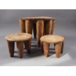 Three mid 20th century Nigerian hardwood (iroko) Nupe stools, collected in 1950s in Abuja, largest