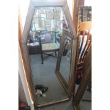 An Art Deco design silvered shaped frame wall mirror, plate 48" x 18"