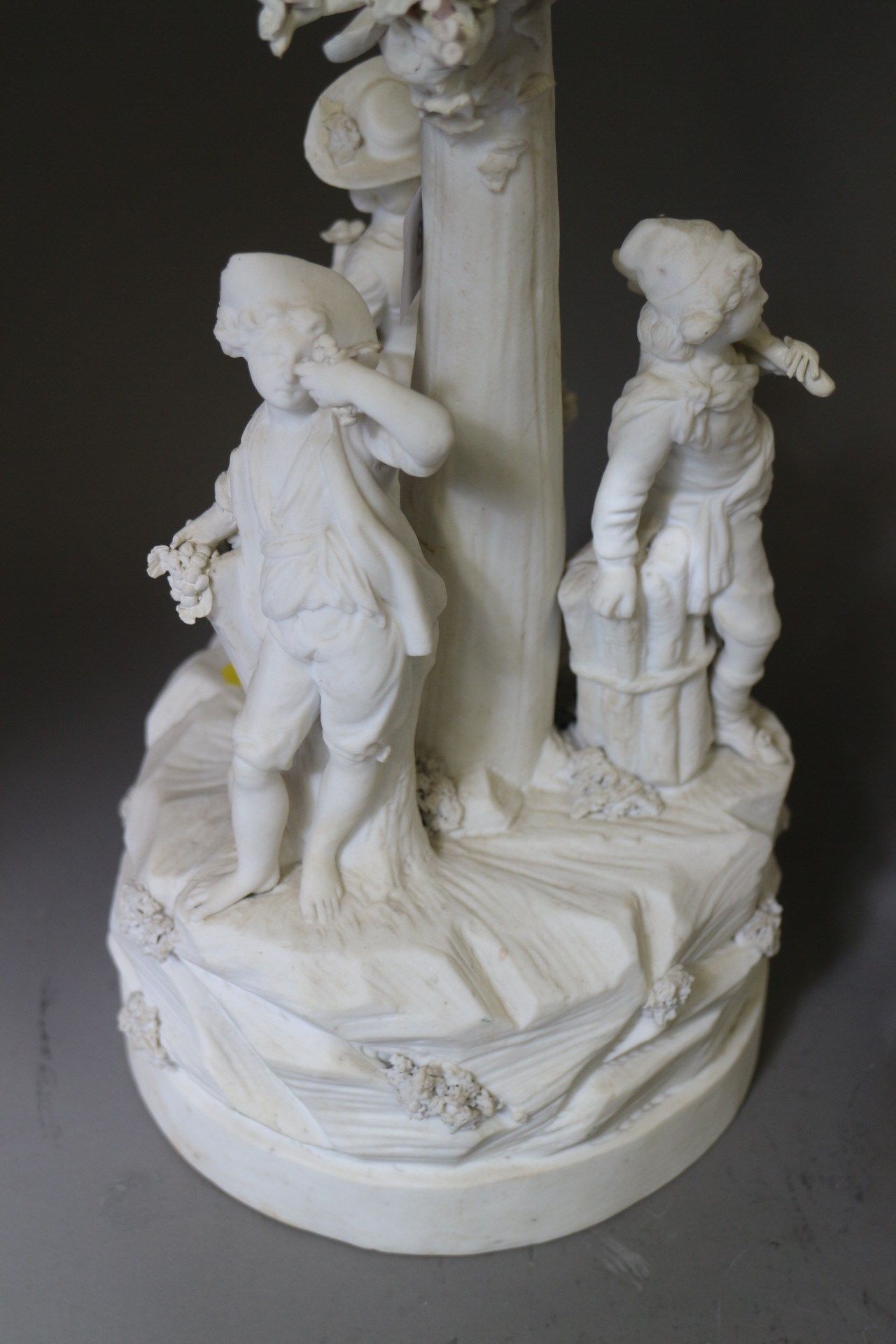 A late 18th century French bisque porcelain table centre, figures round a tree, on circular base, - Image 2 of 4