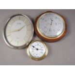 A Neptune's tide clock, 6" dia, a Shortland circular barometer, 10 1/2" dia overall, and a Peers