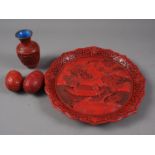 A Chinese carved cinnabar lacquer dish, decorated figures in a boat, seal mark to base, 9 1/2"