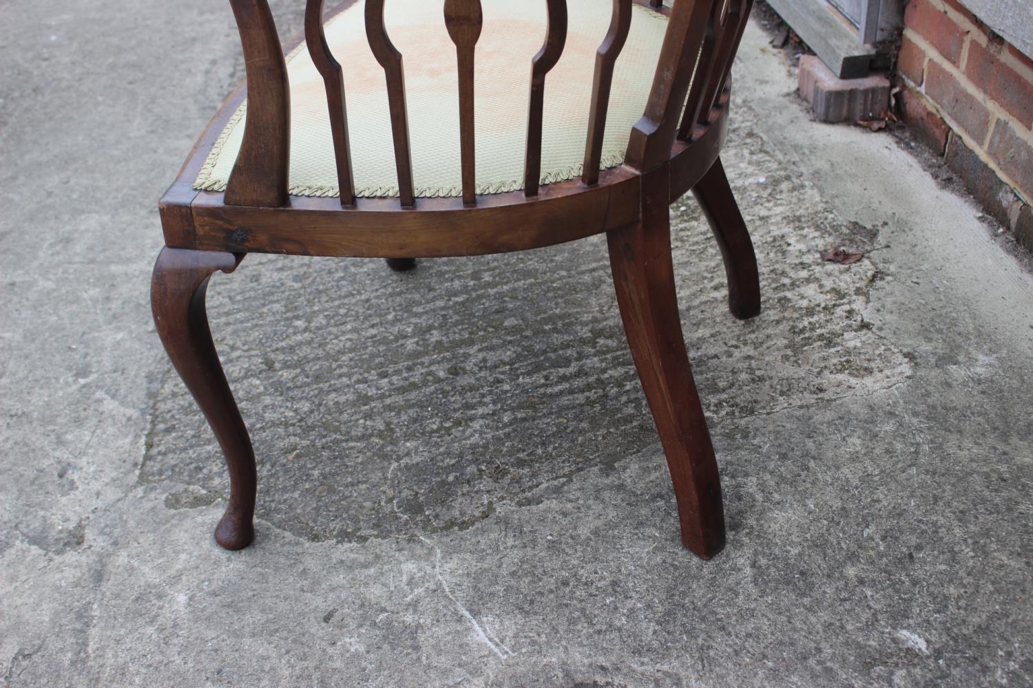 A late 19th century mahogany shaped vertical rail back open armchair with padded seat, on cabriole - Image 4 of 4