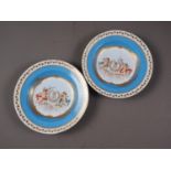 A pair of 19th century Sevres Chateau Fontainebleau soup plates with cherubs and monogram centres,