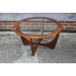 A G Plan teak circular top occasional table, on 'X' frame support, 37 1/2" dia x 17 1/2" high