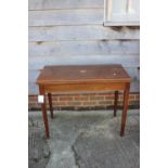 A mahogany and banded and inlaid fold-over top card table, on square taper supports, 36" wide x