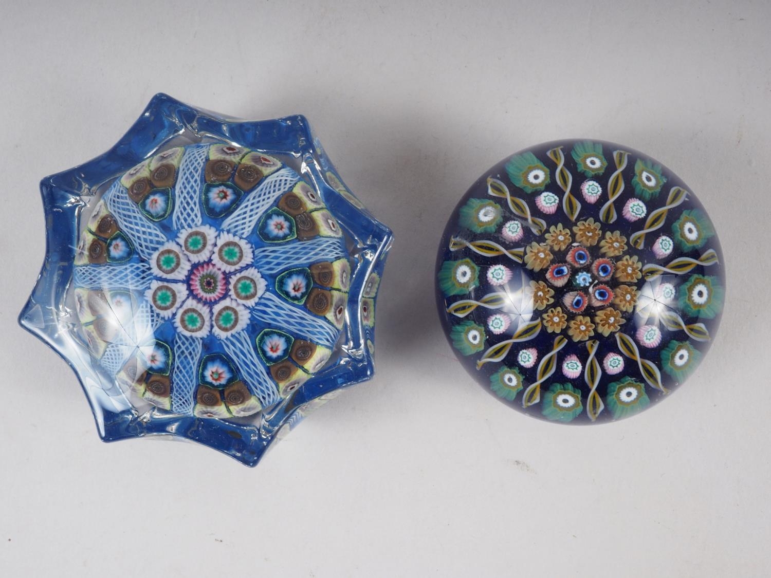 A Strathearn type star shape paperweight with radiant canes, 3" wide, and a similar paperweight, 2