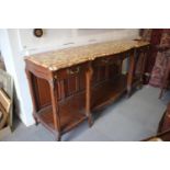 A 19th century French carved oak buffet with serpentine marble top over three drawers and undertier,