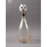 A clear and overlaid cranberry cut glass silver collared decanter, 15" high, and a clear glass