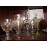 Five late 19th century cut glass rummers, a pair of engraved pedestal glasses, a pair of decanters