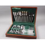 A cased set of Viners stainless steel cutlery with textured handles, a cased set of silver plated