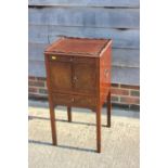 A mahogany tray top bedside cabinet, fitted one drawer over cupboards and one further drawer, 17"