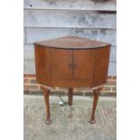 An early 20th century Marconi valve radio, in fitted walnut bowfront corner cabinet, on cabriole