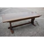 An oak dining table with planked top, on square supports, 84" long x 36" wide x 30" high