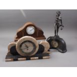 An Art Deco style marble mantel clock with black and gilt dial, Roman numerals and a pair of