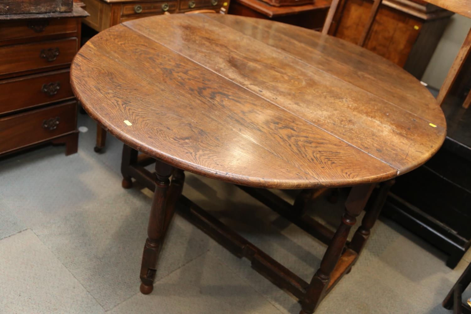 A 19th century oak oval gate leg dining table, on turned and stretchered supports, 48" wide x 62 1/ - Image 2 of 5