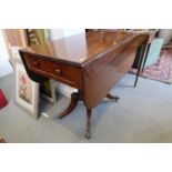 A late 19th century mahogany Pembroke table, fitted one drawer, on quadruple turned columns and