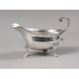 A silver sauce boat with scrolled handle, 3.2oz troy approx