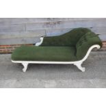 A late 19th century painted frame chaise longue with scroll arm, upholstered in a green Draylon,