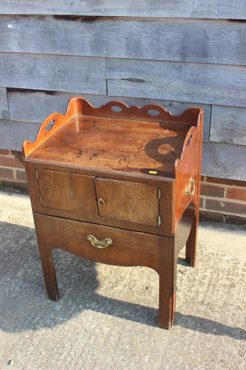 A 19th century mahogany tray top washstand enclosed two doors over pull-out slide, 21 1/2" wide x