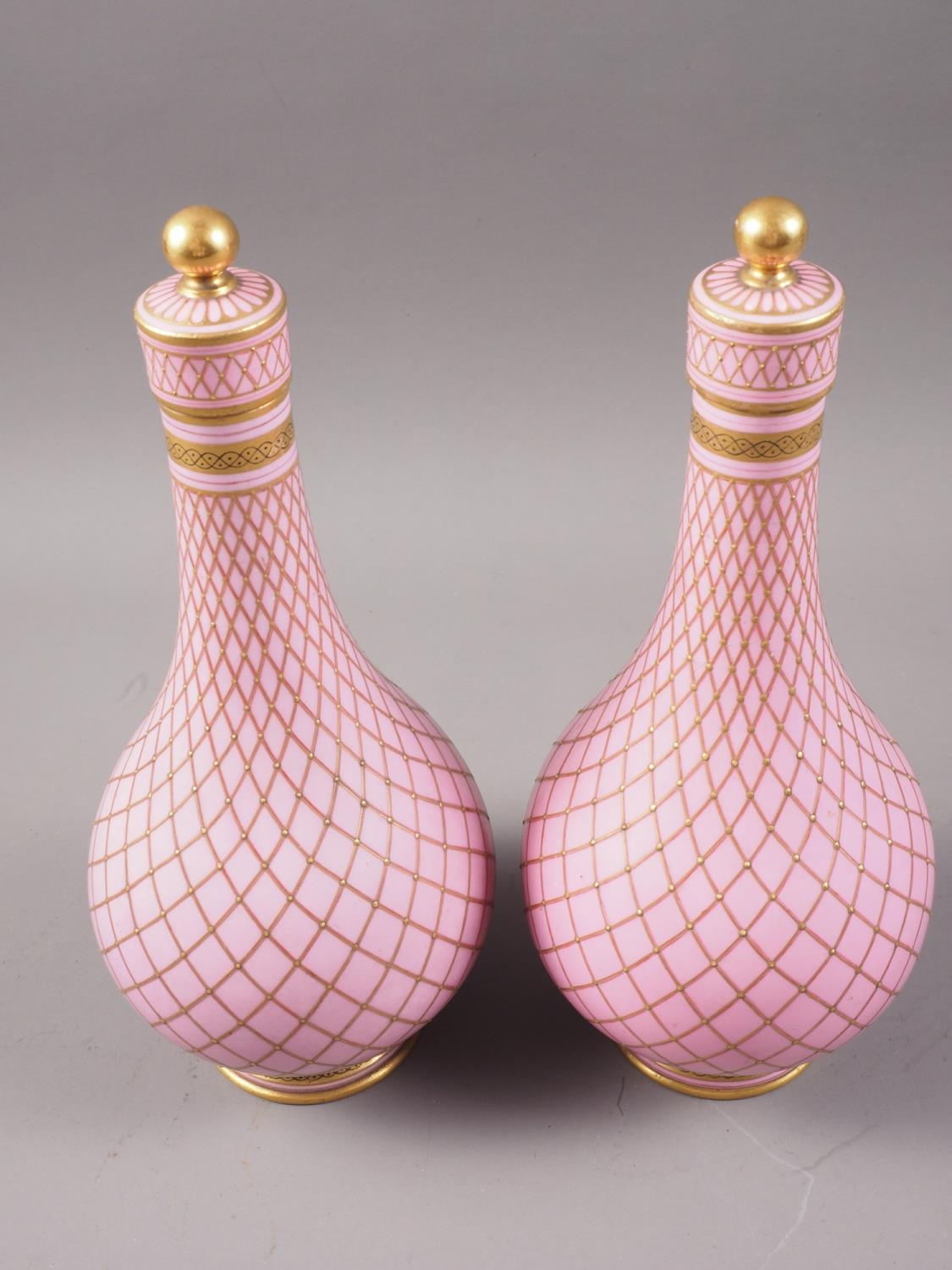 A pair of Sevres style porcelain bottle vases and covers with all-over lattice decoration on a - Image 2 of 3