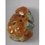 A Chinese carved jade boulder with monkey and mythical beast, 4.6cm x 3.6cm approx