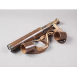 An early 20th century Ultra brass three-draw telescope, in leather case, by B C & Co Ltd, London