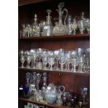 A triple ring necked decanter, six other decanters, a jug, two similar vases and a pair of cut glass