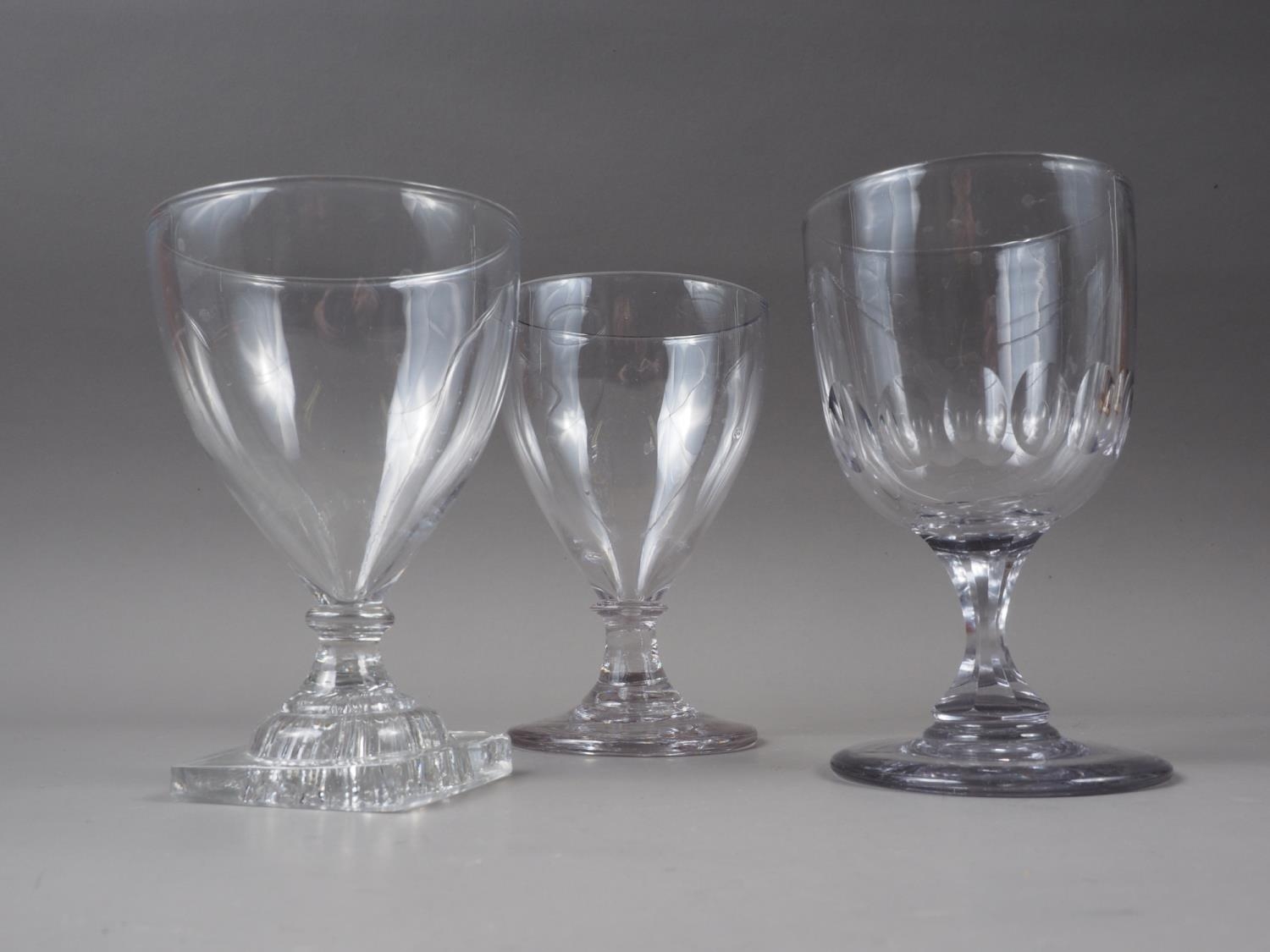 A 19th century glass rummer, on lemon squeezer base, 6" high, and two other rummers