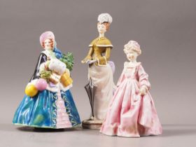 Three Royal Worcester bone china figures, "Noel", by Williams & Bray, 7" high (chip to bonnet), "