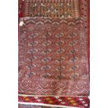 An antique Bokhara rug with twenty-four guls in traditional shades, 43" x 38" approx