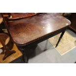 A 19th century mahogany 'D' shape fold-over top card table, on turned and tapering supports, 36"