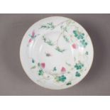 A Chinese famille verte bowl, decorated strawberries, insects and foliage, six-character mark to