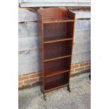 An Edwardian mahogany and inlaid open bookcase, 16" wide x 6 1/2" deep x 45 1/2" high, and a child's