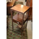 A late 19th century mahogany three-tier washstand, fitted one drawer, on chamfered supports, 14"