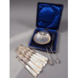 A set of silver bladed and mother-of-pearl handled fruit knives and forks, a silver shell-shaped