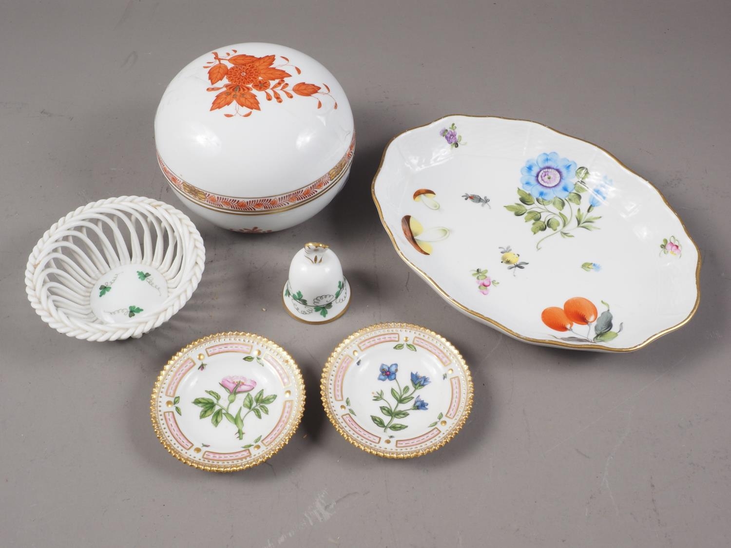 A Herend porcelain circular box and cover, a Herend porcelain floral decorated shaped nut dish, a