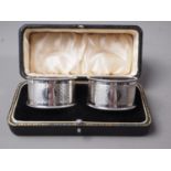 A pair of silver napkin rings, in box, 1.6oz troy approx