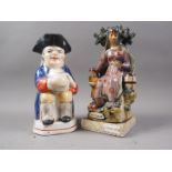 A 19th century style Staffordshire pottery figure "Widow", 10" high, and a similar pottery Toby jug,